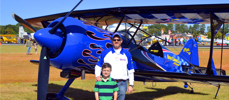 Air Show Attendees pose with Greg Connell Plane